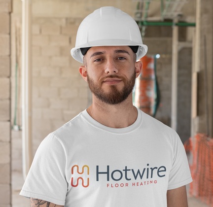 A licensed installer in a Hotwire Floor Heating shirt on site